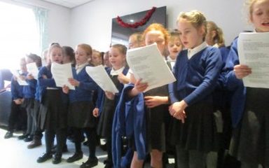 Carol Singing at the QE